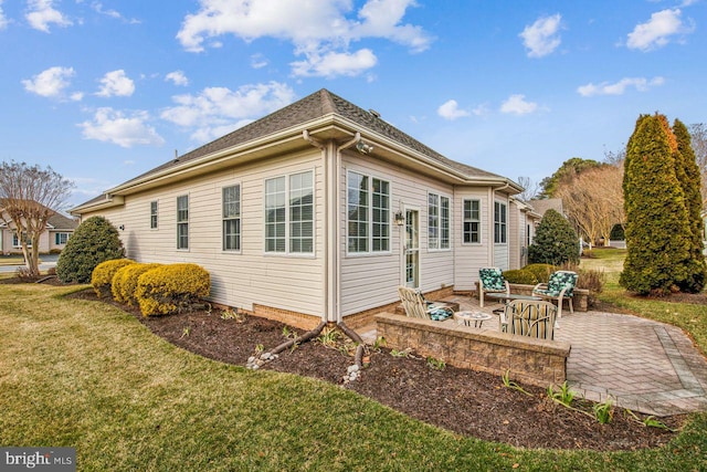 view of property exterior featuring a yard and a patio