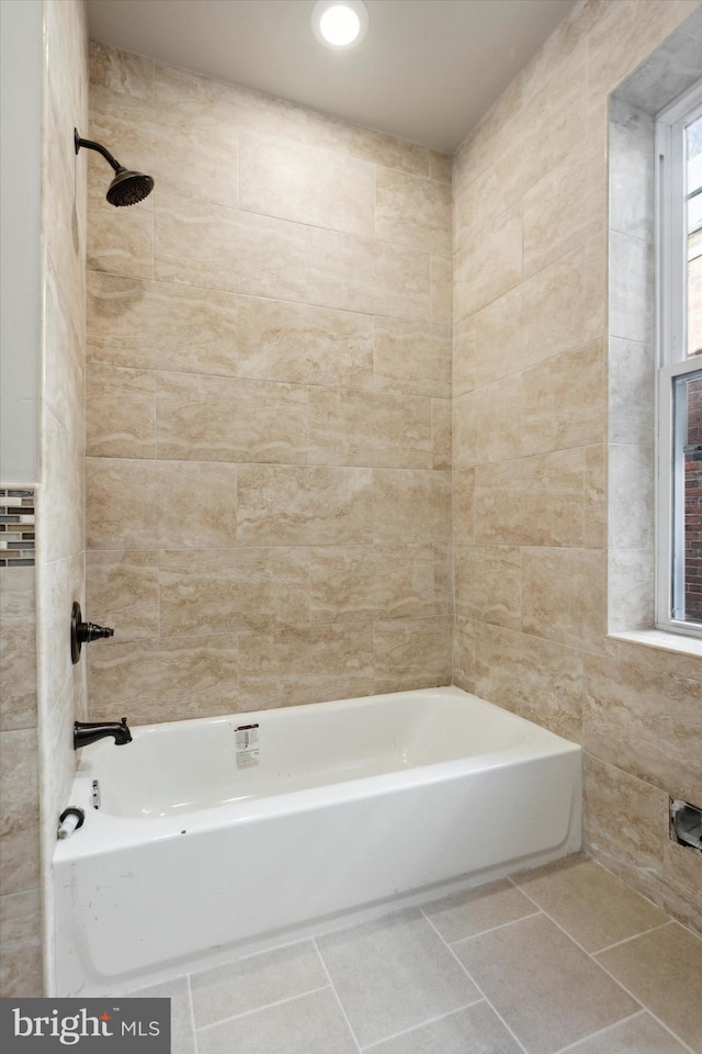 full bathroom with shower / washtub combination, tile walls, and tile patterned floors