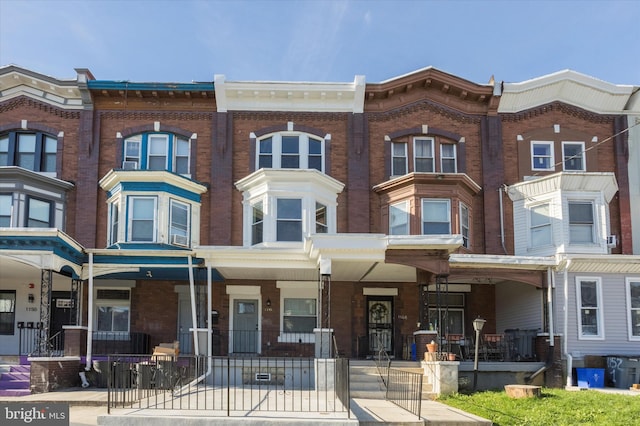 view of front of home featuring brick siding