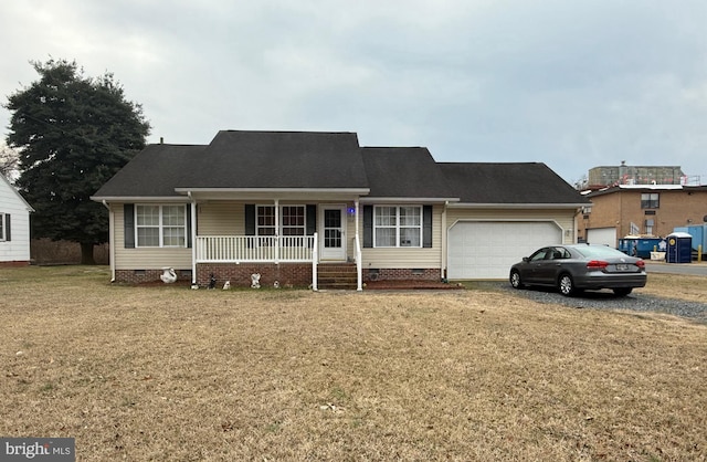 ranch-style home with a porch, crawl space, an attached garage, and a front lawn