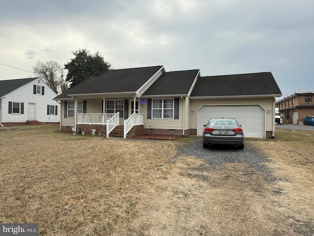 ranch-style home with driveway, crawl space, an attached garage, a porch, and a front yard