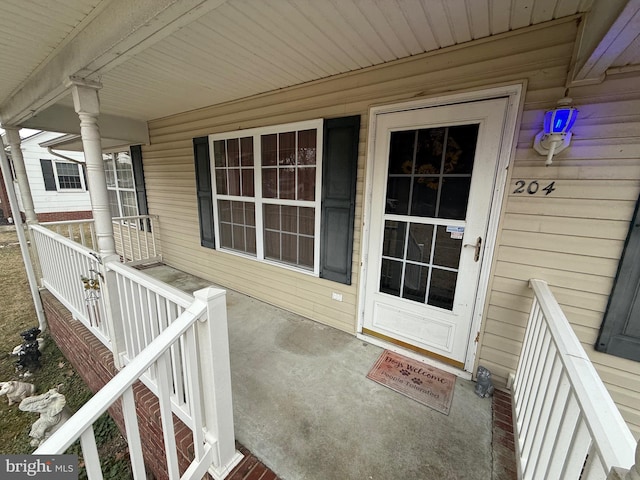 doorway to property with a porch