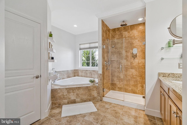 bathroom with a stall shower, crown molding, tile patterned flooring, a bath, and vanity