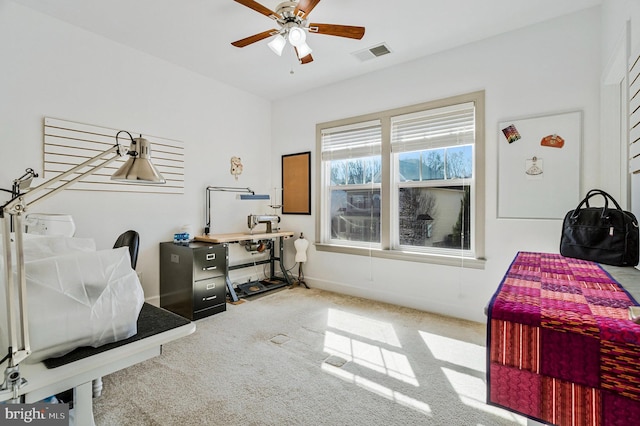 carpeted bedroom featuring visible vents, a ceiling fan, and baseboards