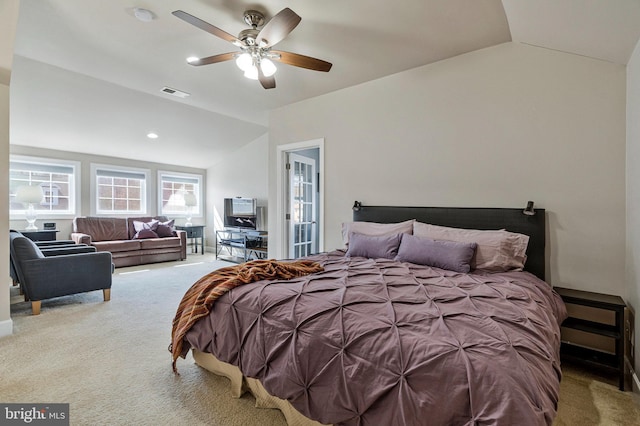 bedroom with visible vents, lofted ceiling, carpet floors, and a ceiling fan