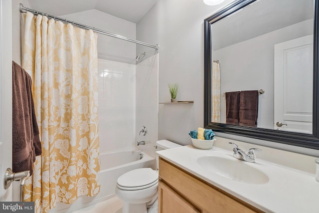 full bathroom featuring vanity, vaulted ceiling, toilet, and shower / bath combo