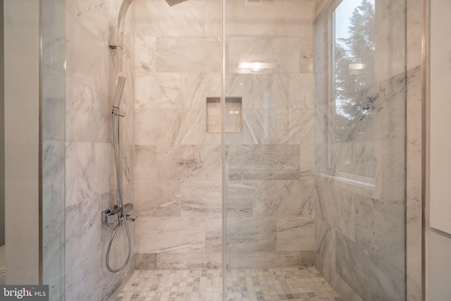 full bathroom with a tile shower