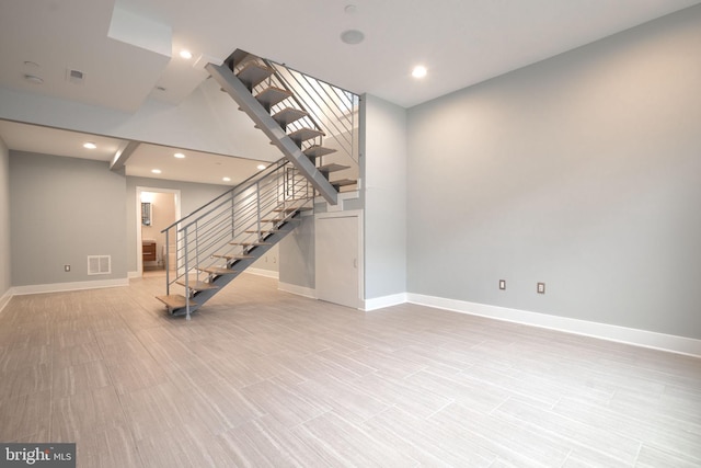 interior space featuring baseboards, stairs, visible vents, and recessed lighting