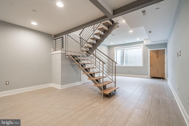 interior space featuring recessed lighting, wood finished floors, visible vents, and baseboards