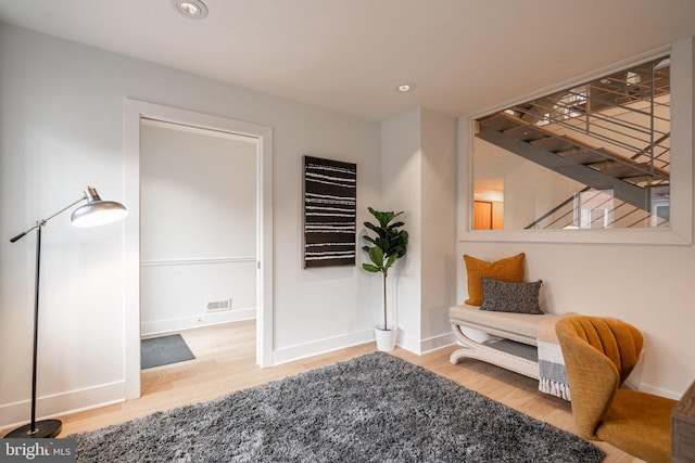 interior space featuring stairs, recessed lighting, wood finished floors, and baseboards