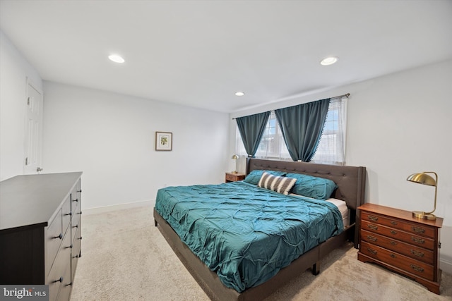 bedroom with light carpet, baseboards, and recessed lighting