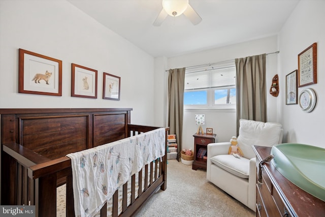 bedroom featuring light carpet and ceiling fan