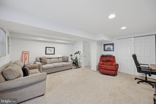 carpeted living area featuring recessed lighting