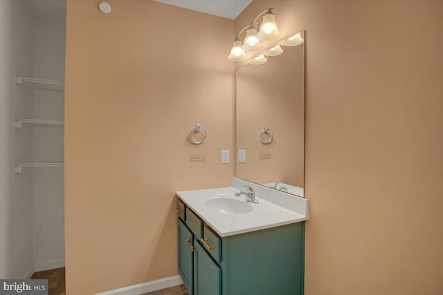 bathroom featuring vanity and baseboards