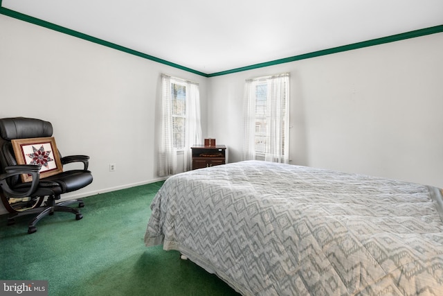 bedroom featuring baseboards and carpet flooring