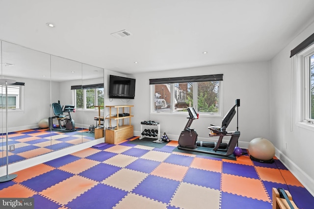 workout room with baseboards, visible vents, and recessed lighting