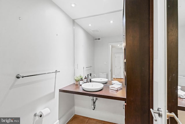 bathroom with recessed lighting, visible vents, vanity, and tile patterned floors