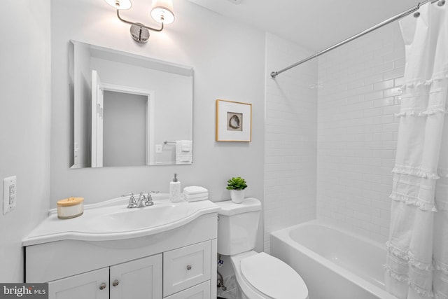 full bathroom featuring vanity, shower / bath combination with curtain, and toilet