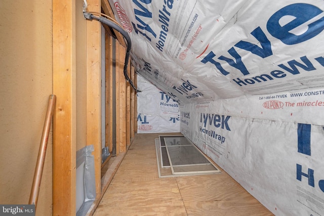 hallway with lofted ceiling