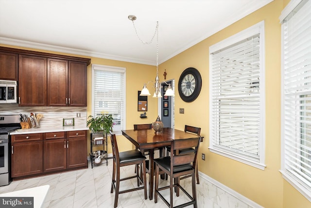 dining area with marble finish floor, baseboards, and ornamental molding