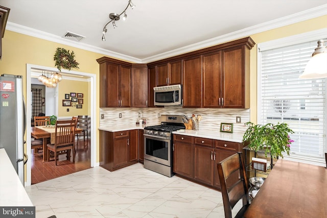 kitchen with stainless steel appliances, visible vents, marble finish floor, ornamental molding, and light countertops