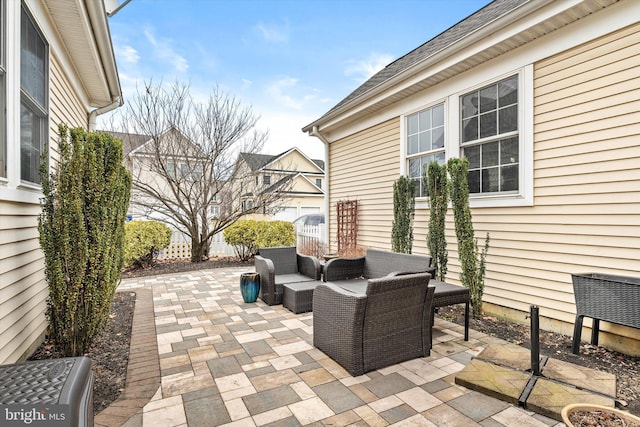 view of patio featuring fence and an outdoor living space