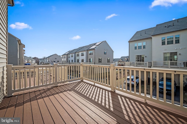 wooden deck with a residential view