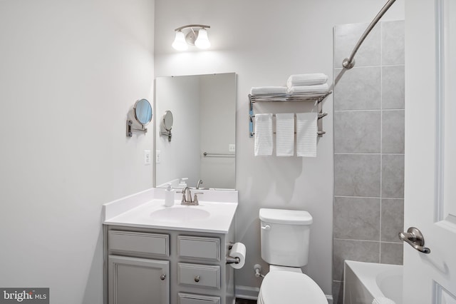 bathroom featuring toilet and vanity