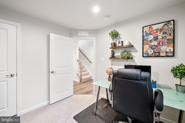 office with baseboards, visible vents, and carpet floors