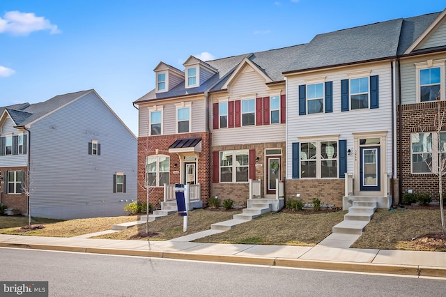 multi unit property featuring brick siding