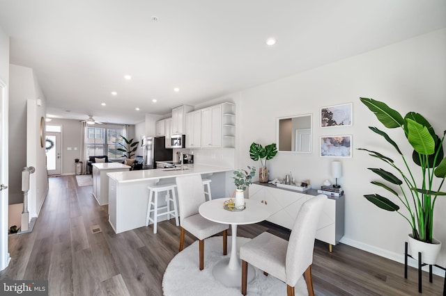 dining space with recessed lighting, a ceiling fan, dark wood-type flooring, and baseboards