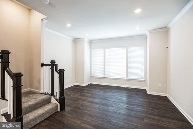 spare room featuring ornamental molding, recessed lighting, dark wood finished floors, and baseboards