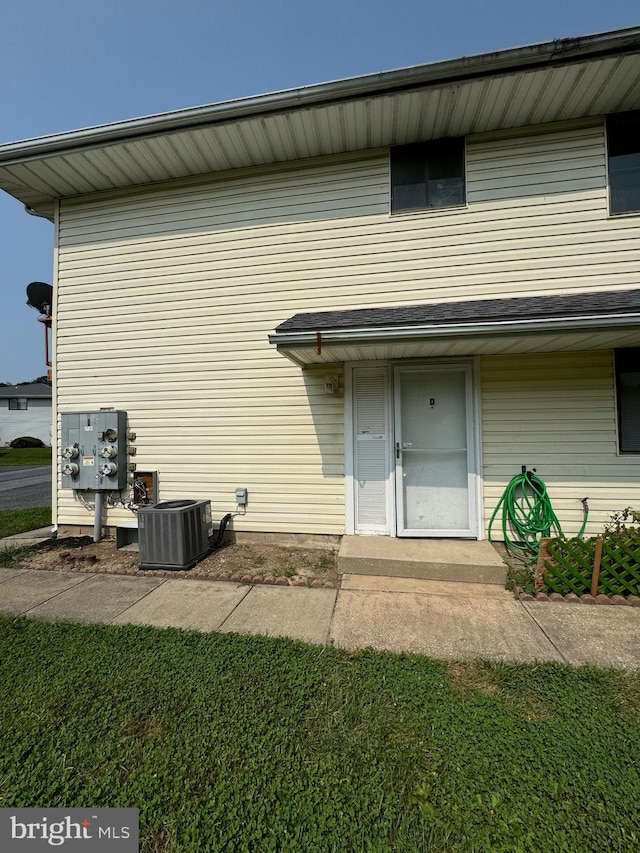 rear view of house with cooling unit