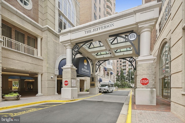 view of street with traffic signs, curbs, and sidewalks