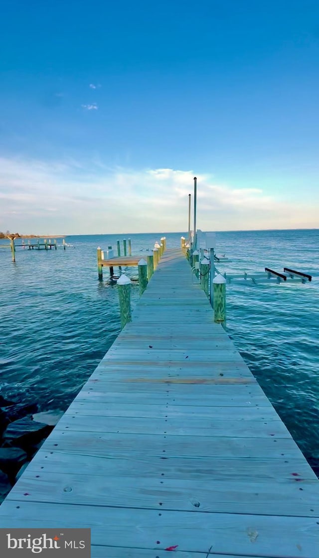 view of dock with a water view