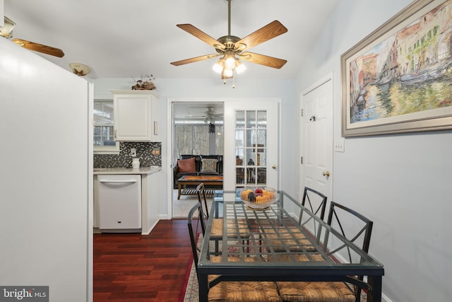 dining space with ceiling fan and dark wood-style flooring