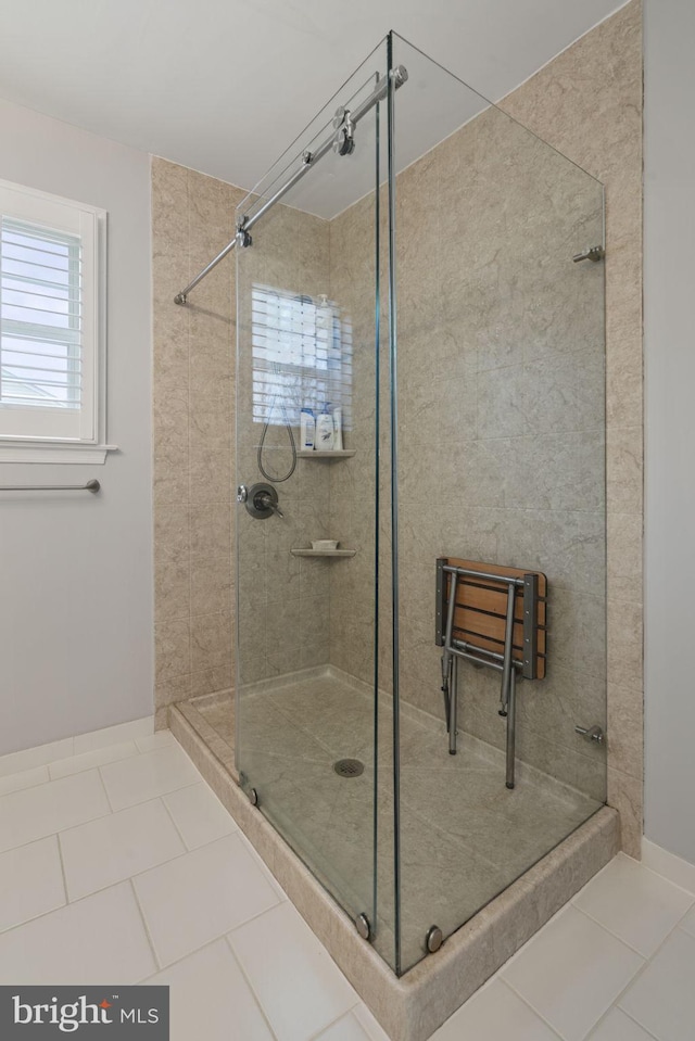 bathroom featuring a stall shower and tile patterned flooring