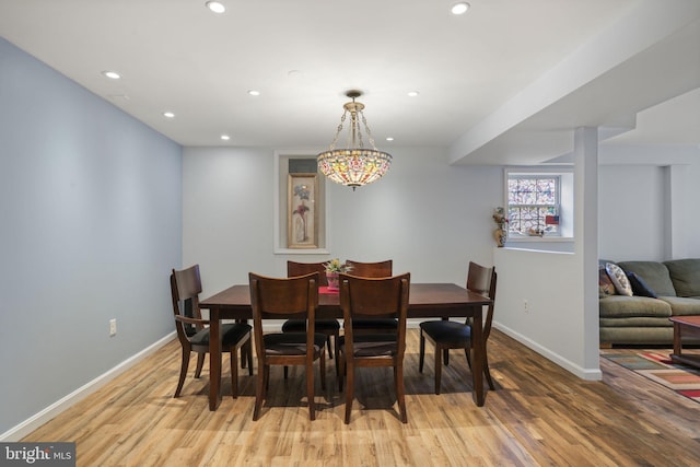 dining room with recessed lighting, baseboards, and light wood finished floors