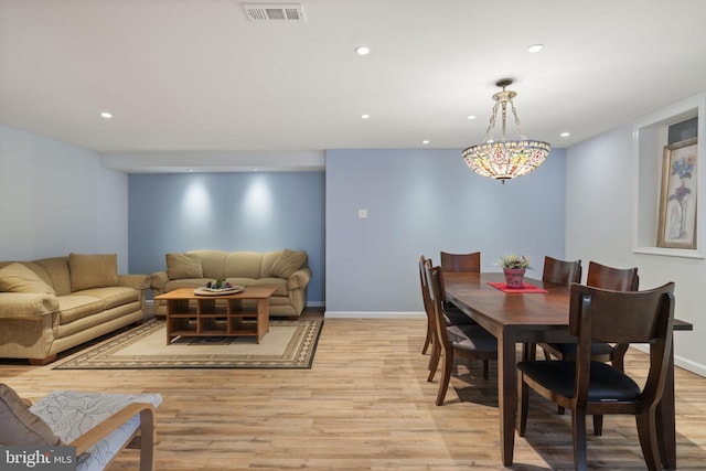 dining room featuring baseboards, recessed lighting, visible vents, and light wood-type flooring