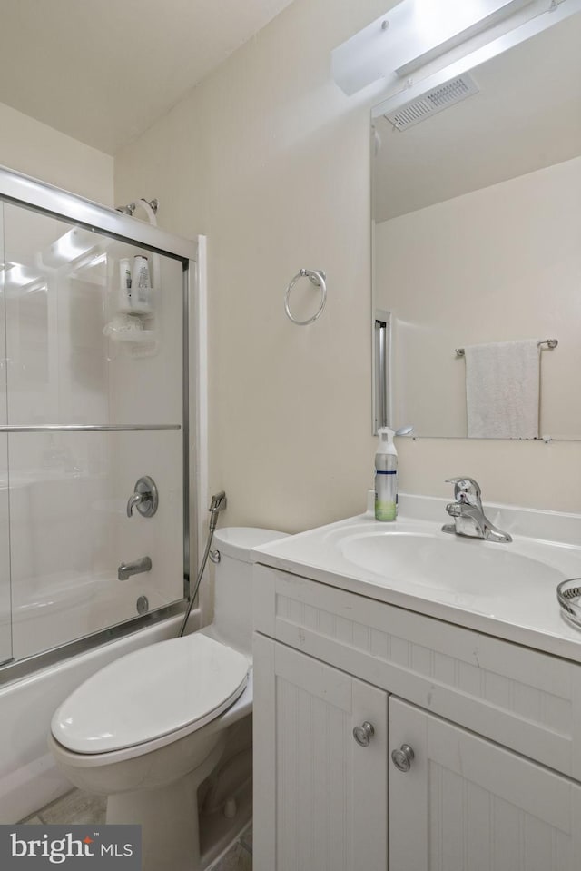 full bath featuring vanity, toilet, visible vents, and enclosed tub / shower combo