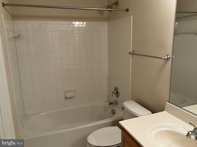 full bath featuring tub / shower combination, vanity, and toilet