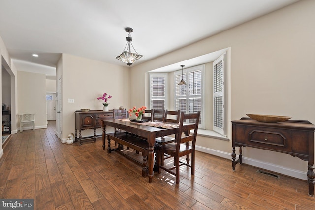 dining space featuring recessed lighting, visible vents, baseboards, and dark wood finished floors