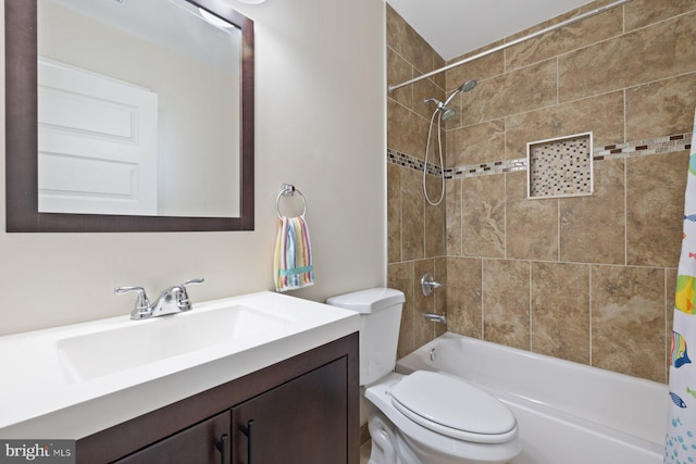 bathroom with shower / bath combo with shower curtain, toilet, and vanity