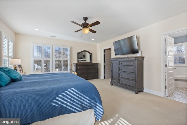 bedroom featuring baseboards, recessed lighting, ceiling fan, light carpet, and connected bathroom