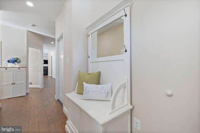 hallway featuring recessed lighting, wood finished floors, and baseboards