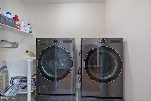 laundry room with washer and dryer and laundry area