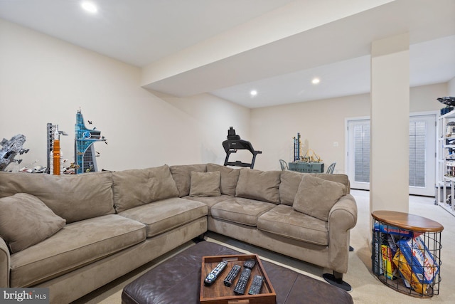 carpeted living area with recessed lighting