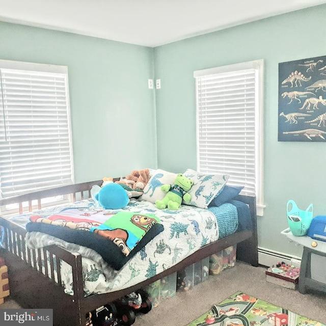 bedroom with a baseboard radiator and carpet flooring