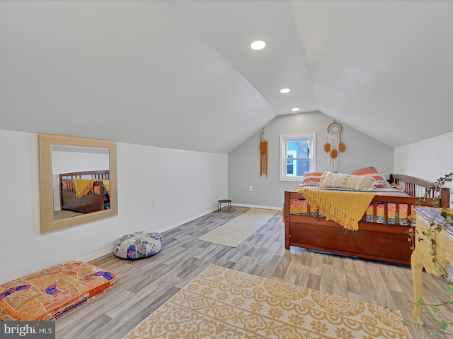 bedroom featuring baseboards, vaulted ceiling, wood finished floors, and recessed lighting