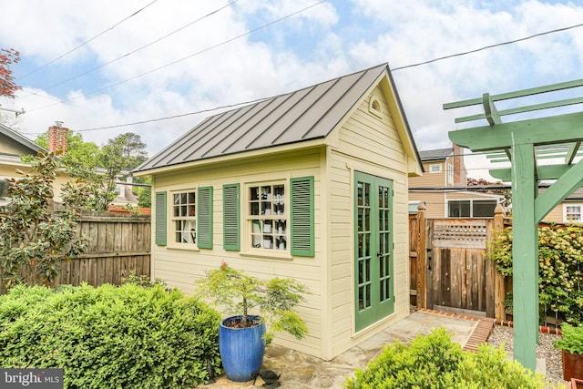 809 Cornell St, Fredericksburg, VA 22401 - view of outdoor structure with fence, french doors, and an outdoor structure